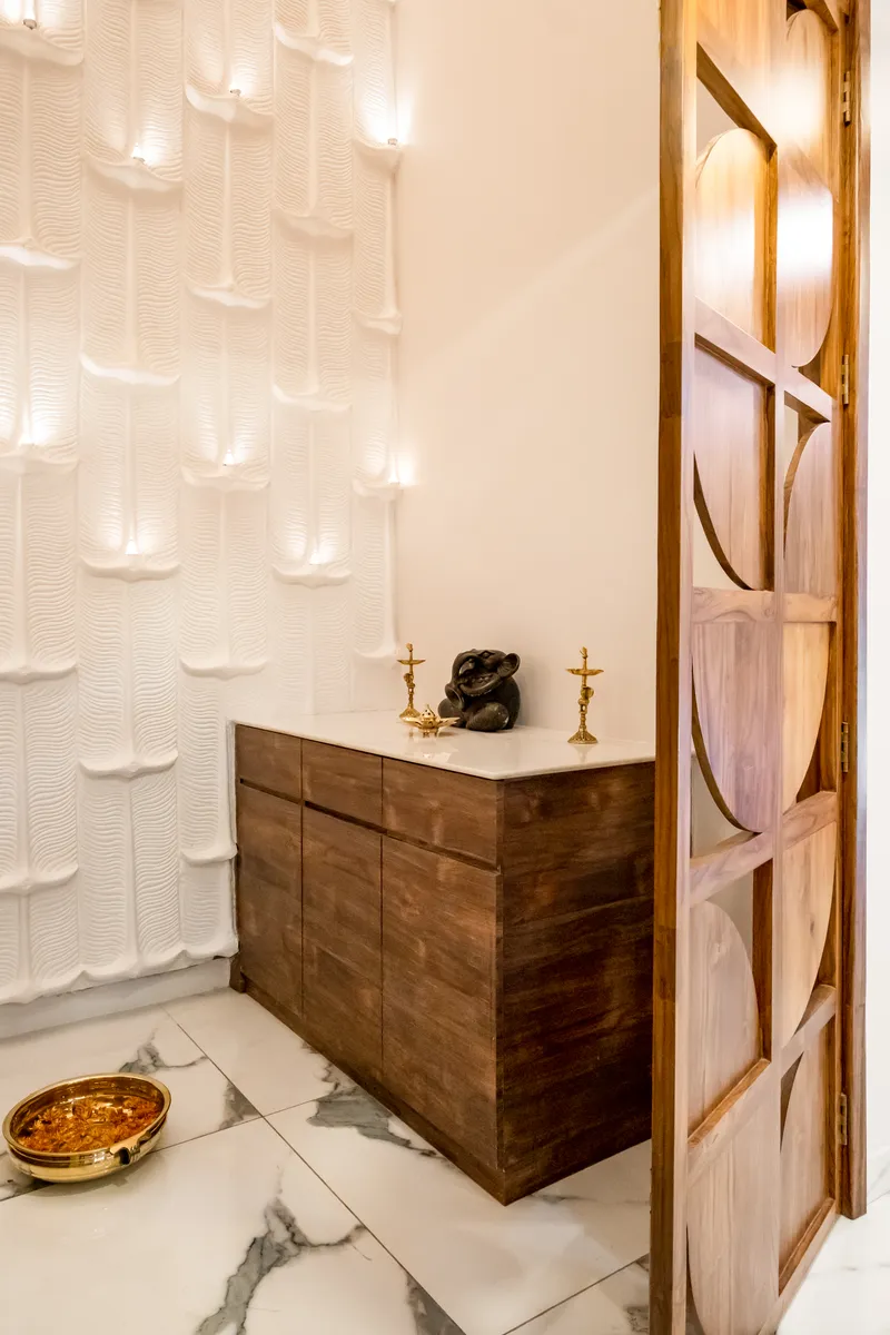 A modern prayer room featuring a gracefully illuminated wall enhancing the serene and contemporary design with a touch of refined calm