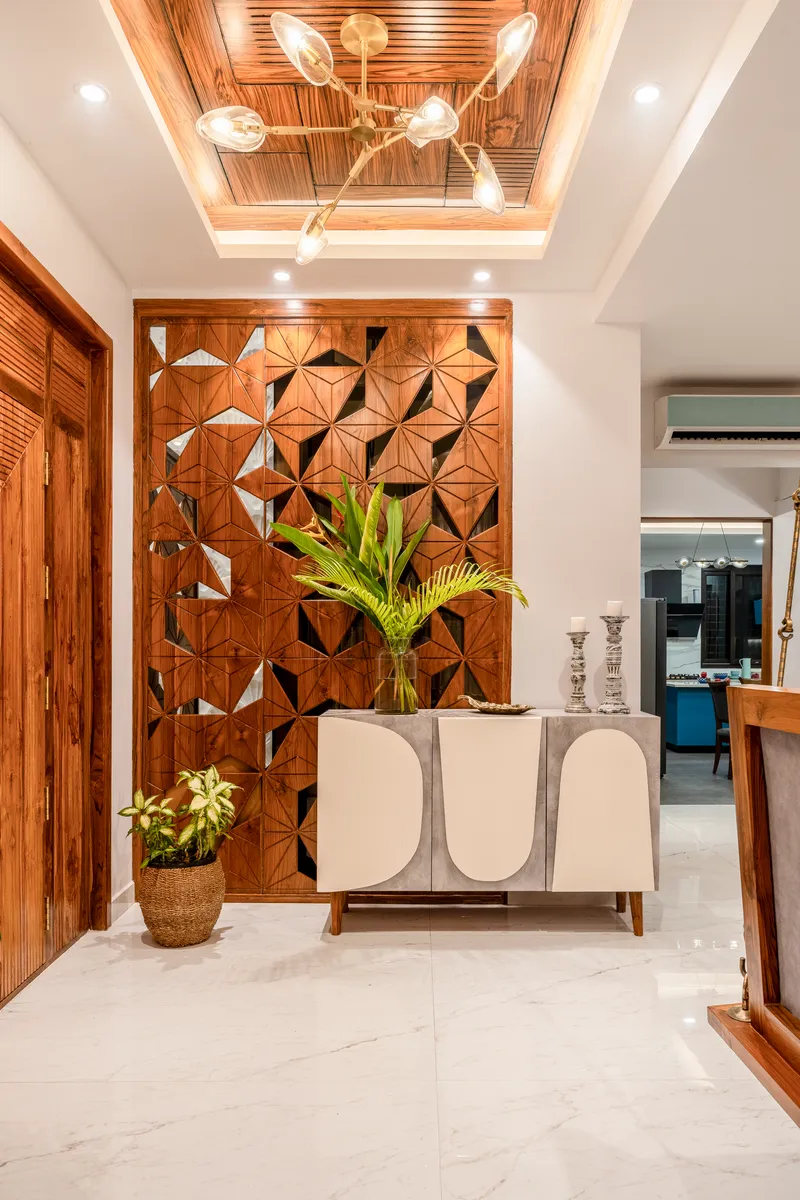 An ambient entranc with a Jali partition adding a touch of intricate artistry and refined charme