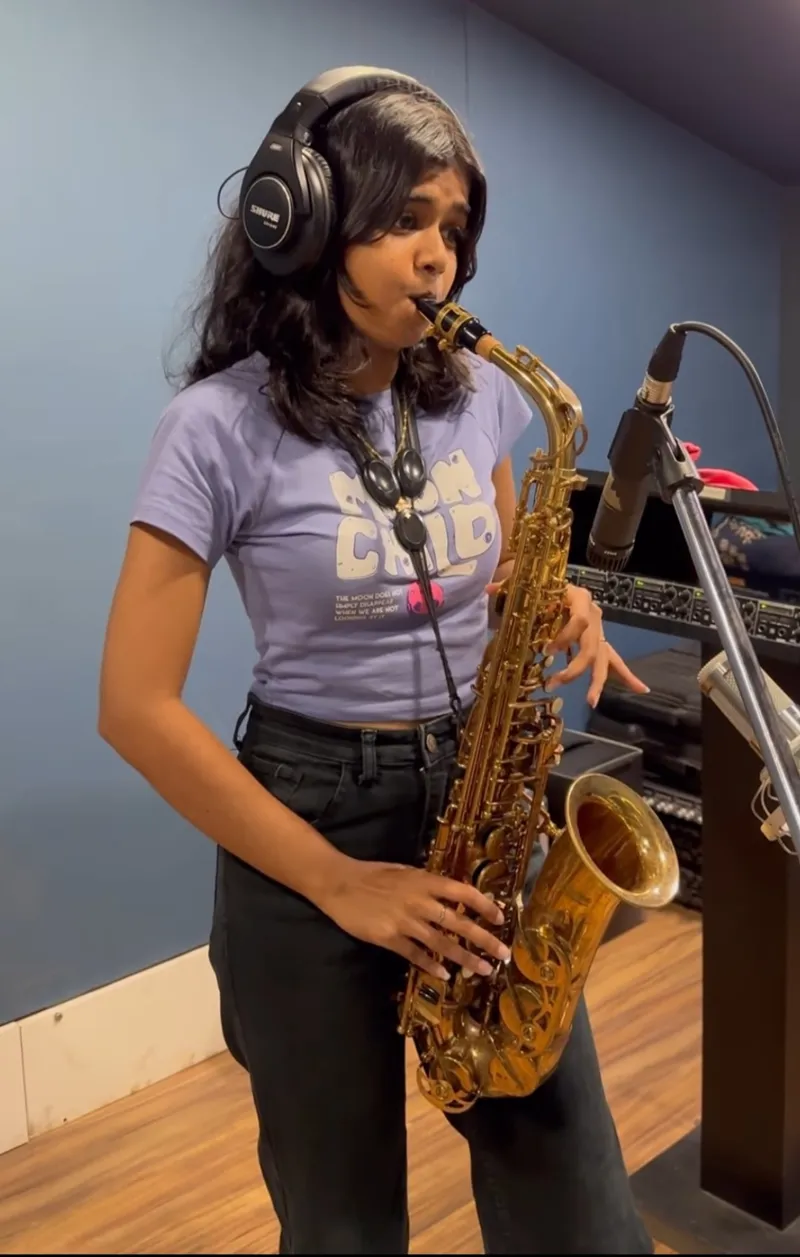 Clarissa practising with alto saxophone at Mumbai in a studio