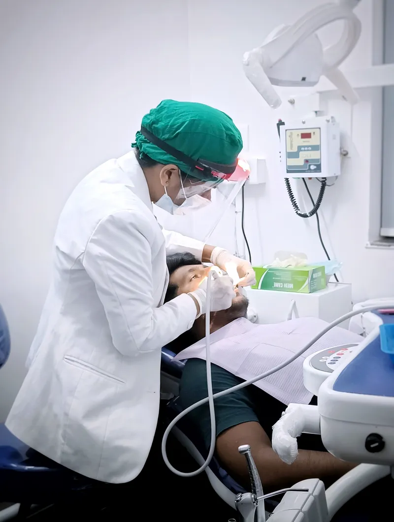 Crafting confident smiles one appointment at a time Dr Hema working on her patient at Ivory Dental Clinic 1
