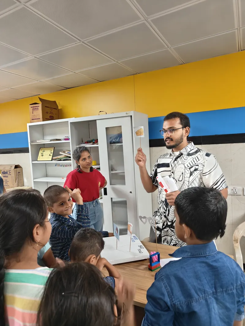 Dr Harshdeep helping kids to understand diet and oral health with the help of fun games 1