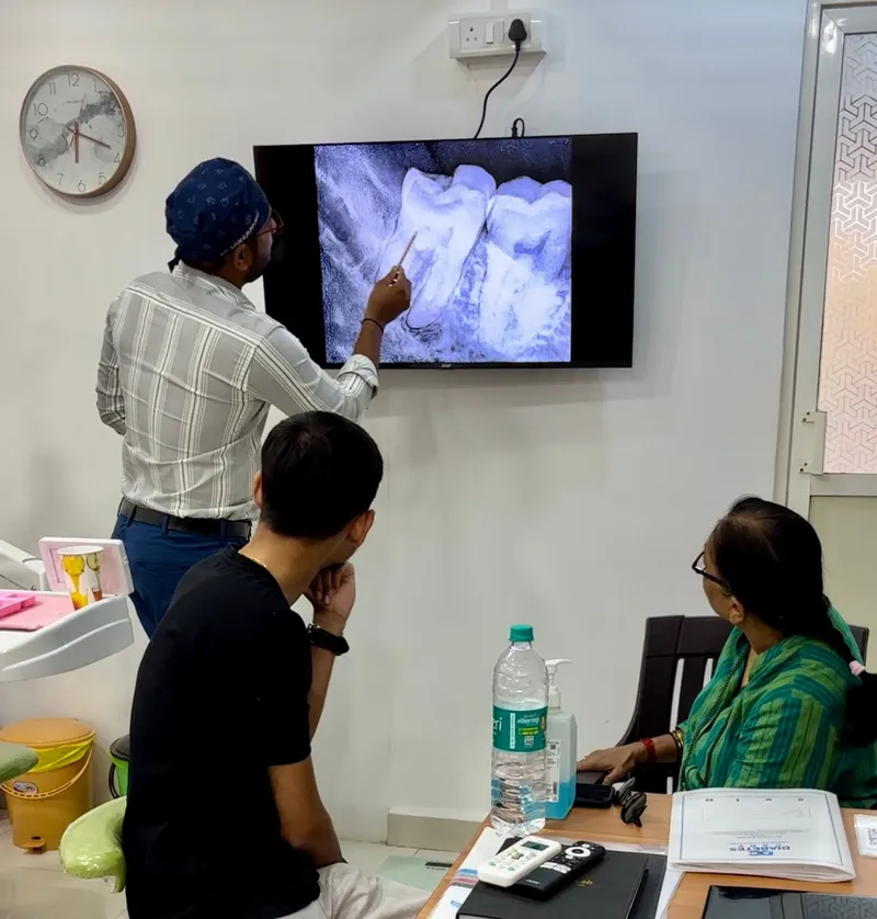 Dr. Chandrakant consulting patients, making it simple for them to understand the problems.