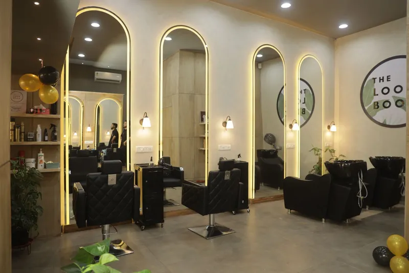 Elegant black‑gold salon interiors with arched mirrors of The Look Book Salon (1)