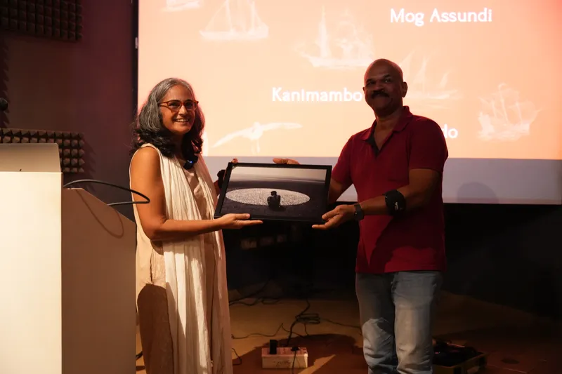Filmmaker and ethnomusicologist Nalini Elvino De Sousa receiving a token of appreciation from Walter Mascarenhas a motivational speaker and Indian Air Force squadron leader retd after her lecture at MOG S