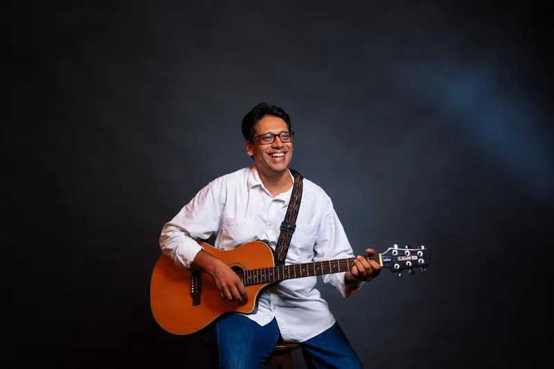Joyful Musician with Acoustic Guitar