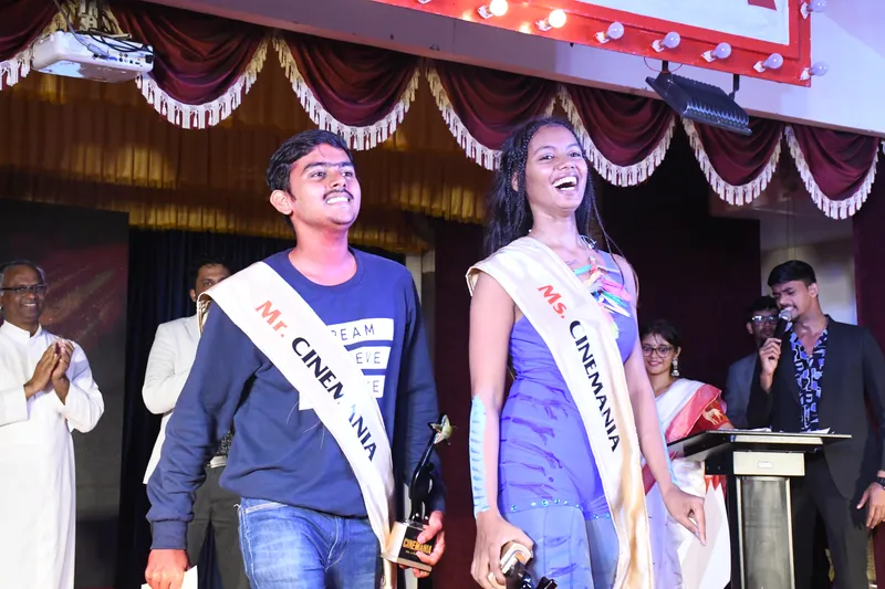 Mr and Ms Cinemania walking down the ramp