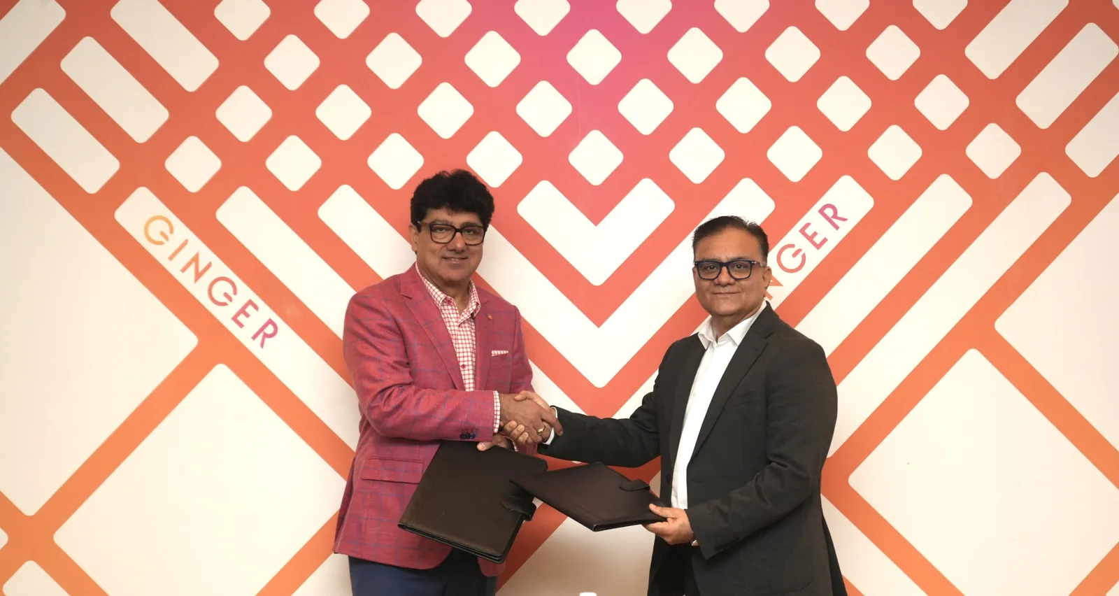 Mr.-Puneet-Chhatwal-MD-CEO-IHCL-and-Aman-Kapoor-CEO-Airport-Land-Development-GMR-at-the-signing-of-Ginger-Mopa