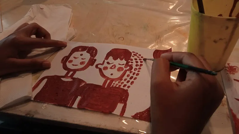Painting of Shravani and Joshua done by Shravani using natural materials at a Kavi Art workshop_