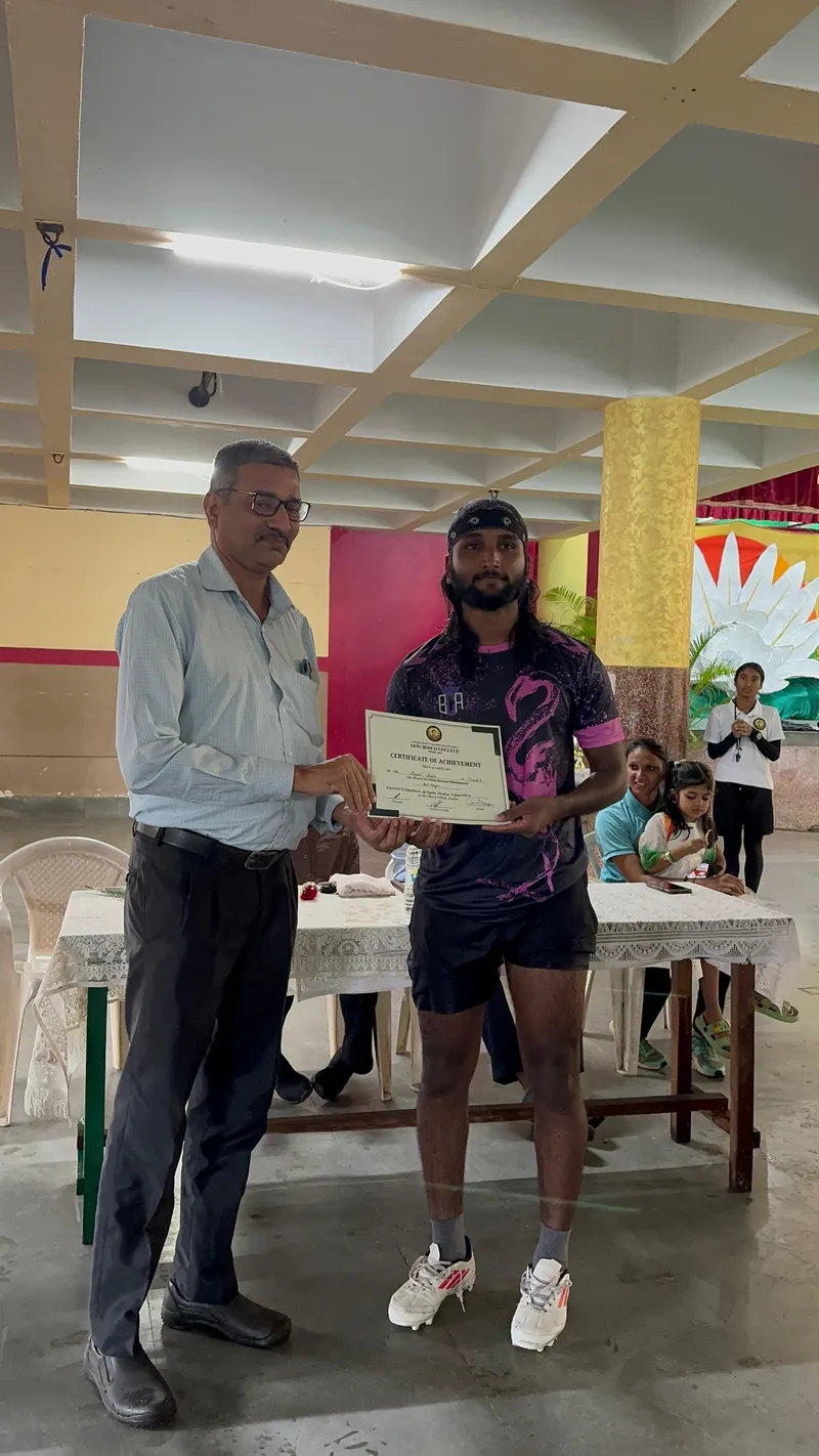 Player of the Tournament Agnel Faria awarded by Principal Dr Cedric Silveira