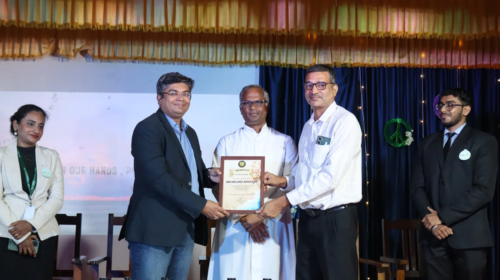 Presentation of a memento to Mr Milind Anvekar