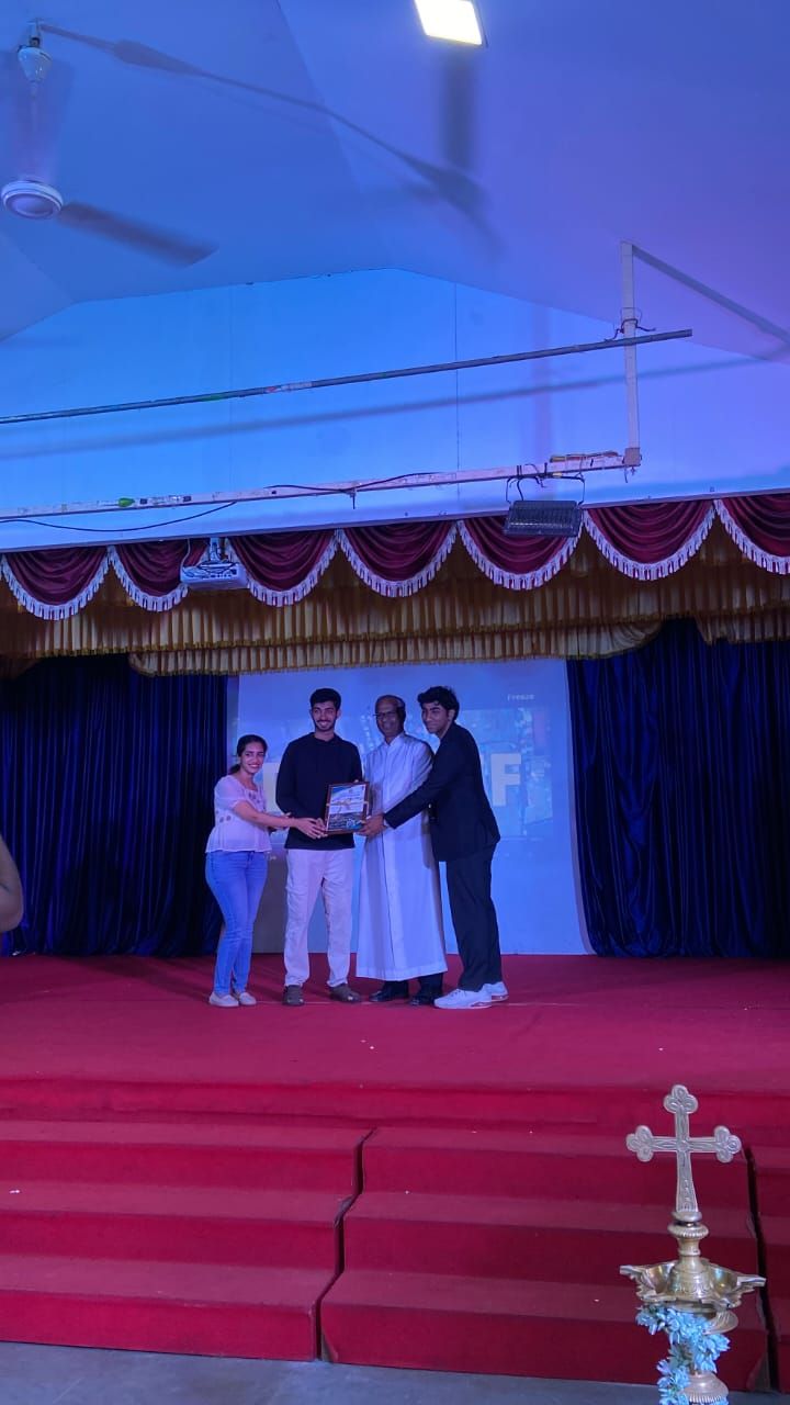 Rameez Shaikh and team being felicitated by Fr Joaquim Lobo