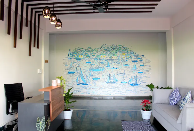 Reception area with the wooden rafter ceiling and the floor to ceiling wall mural for an Officers mess