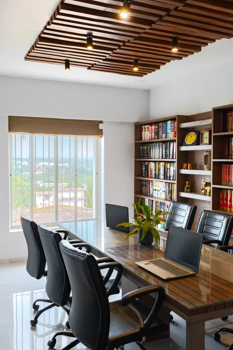 The bright meeting room features a sleek cladded false ceiling adding a touch of elegance and modernity to the space