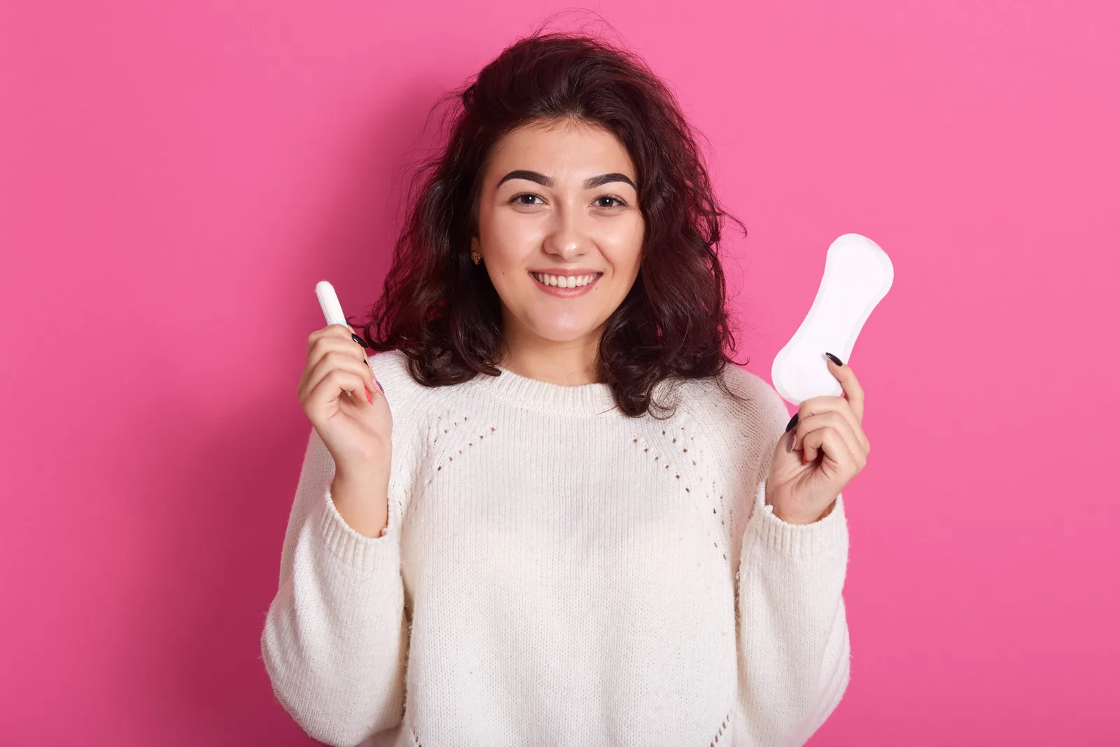 attractive caucasian woman holding cotton tampon sanitary napkin scaled