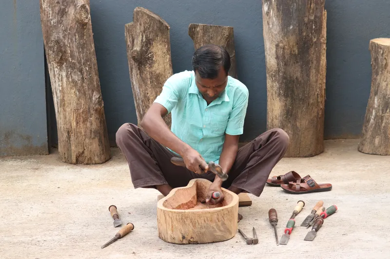 carpenter Bhajan is carving a basin