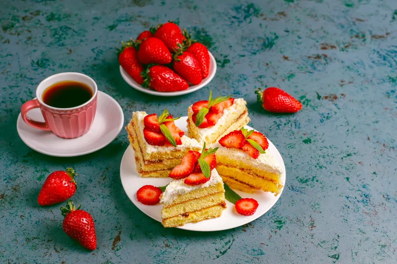 delicious homemade strawberry cake slices with cream fresh strawberries