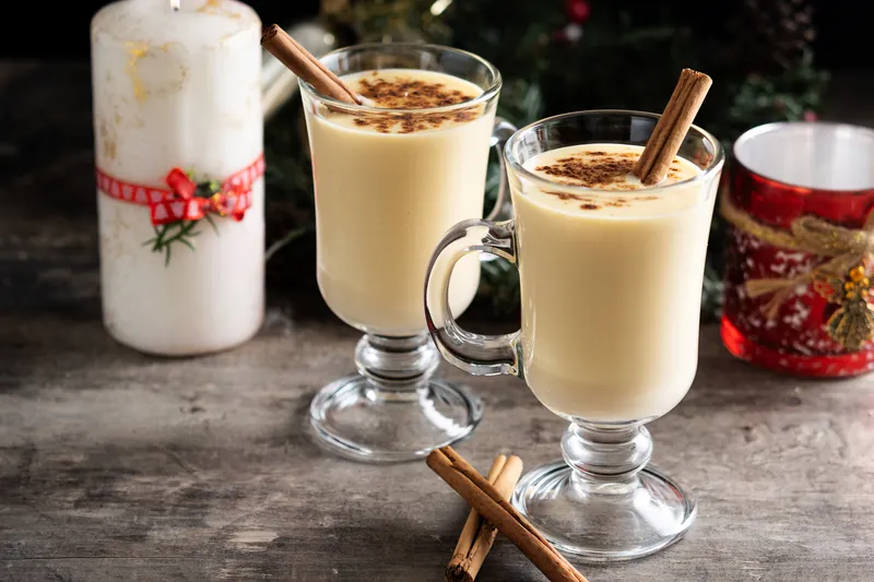 homemade eggnog with cinnamon wooden table typical christmas dessert