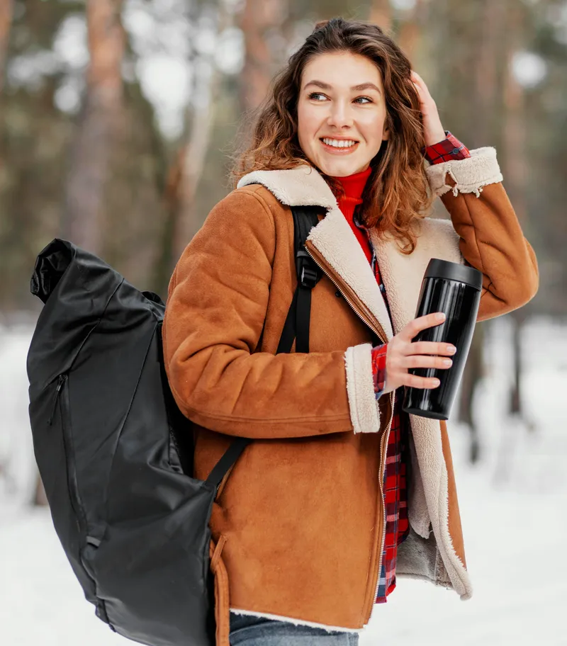 medium shot woman carrying backpack