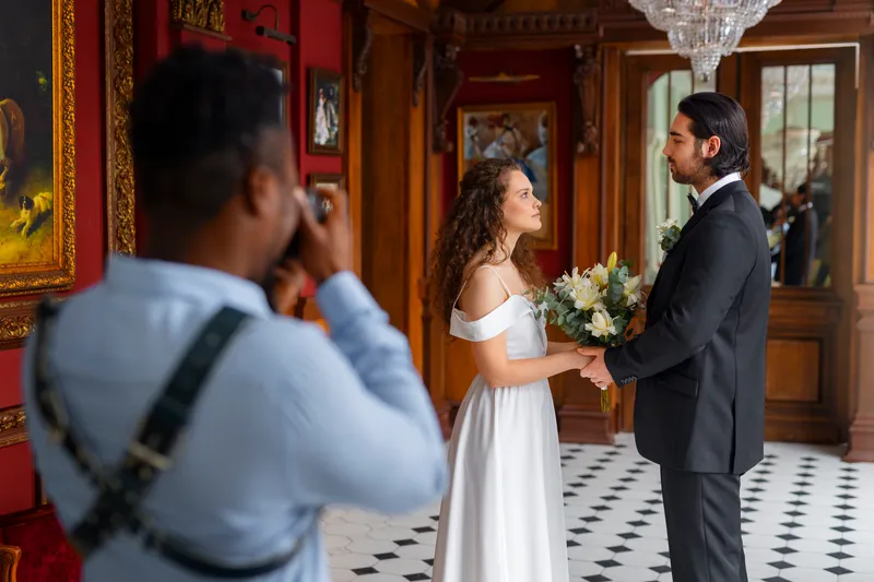 side view photographer taking wedding photos