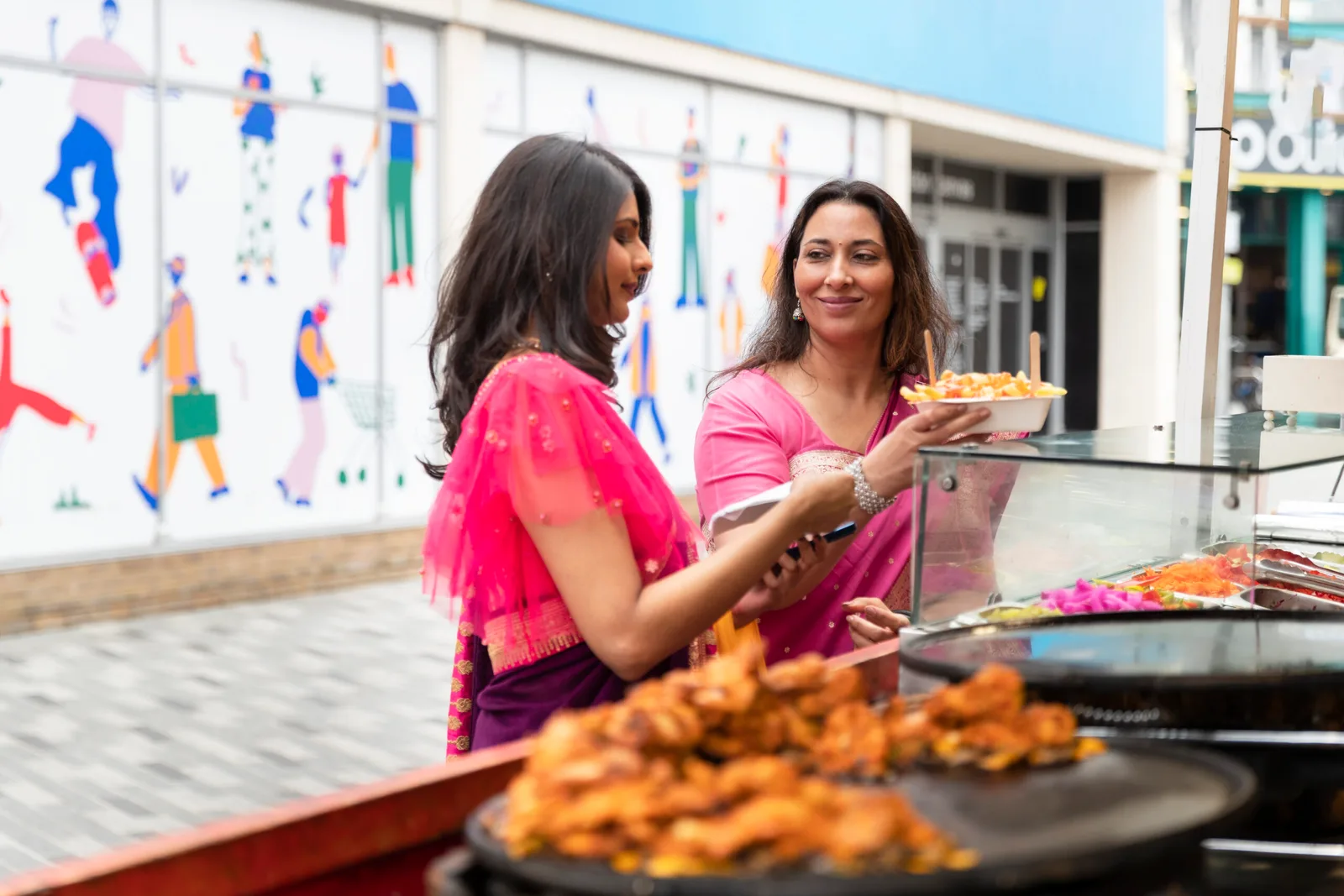 side-view-women-buying-food-1