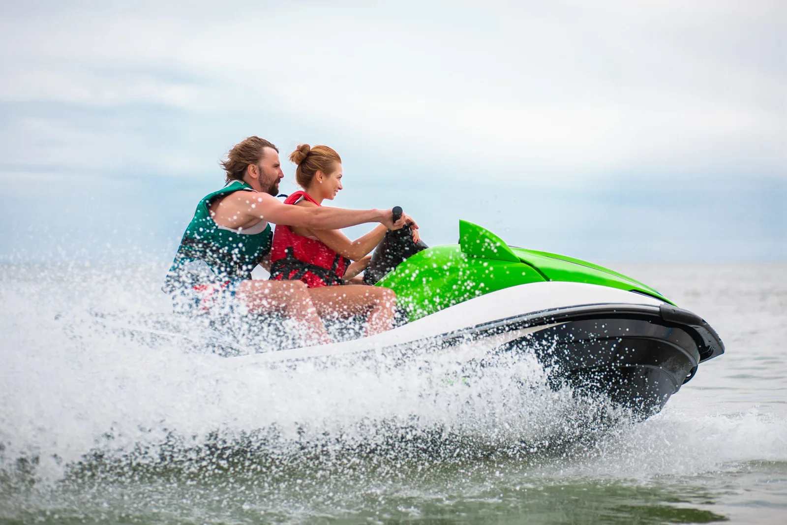 couple having fun on water scooter summer sea activity